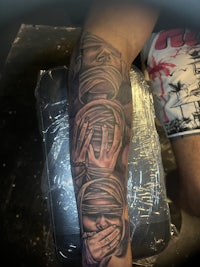 a man with a tattoo on his arm