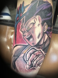 a dragon ball tattoo on a man's arm